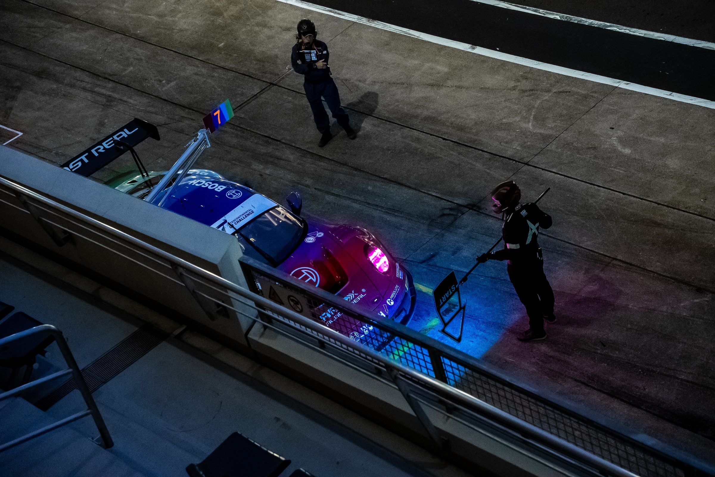 Absolute Racing pit lane at night